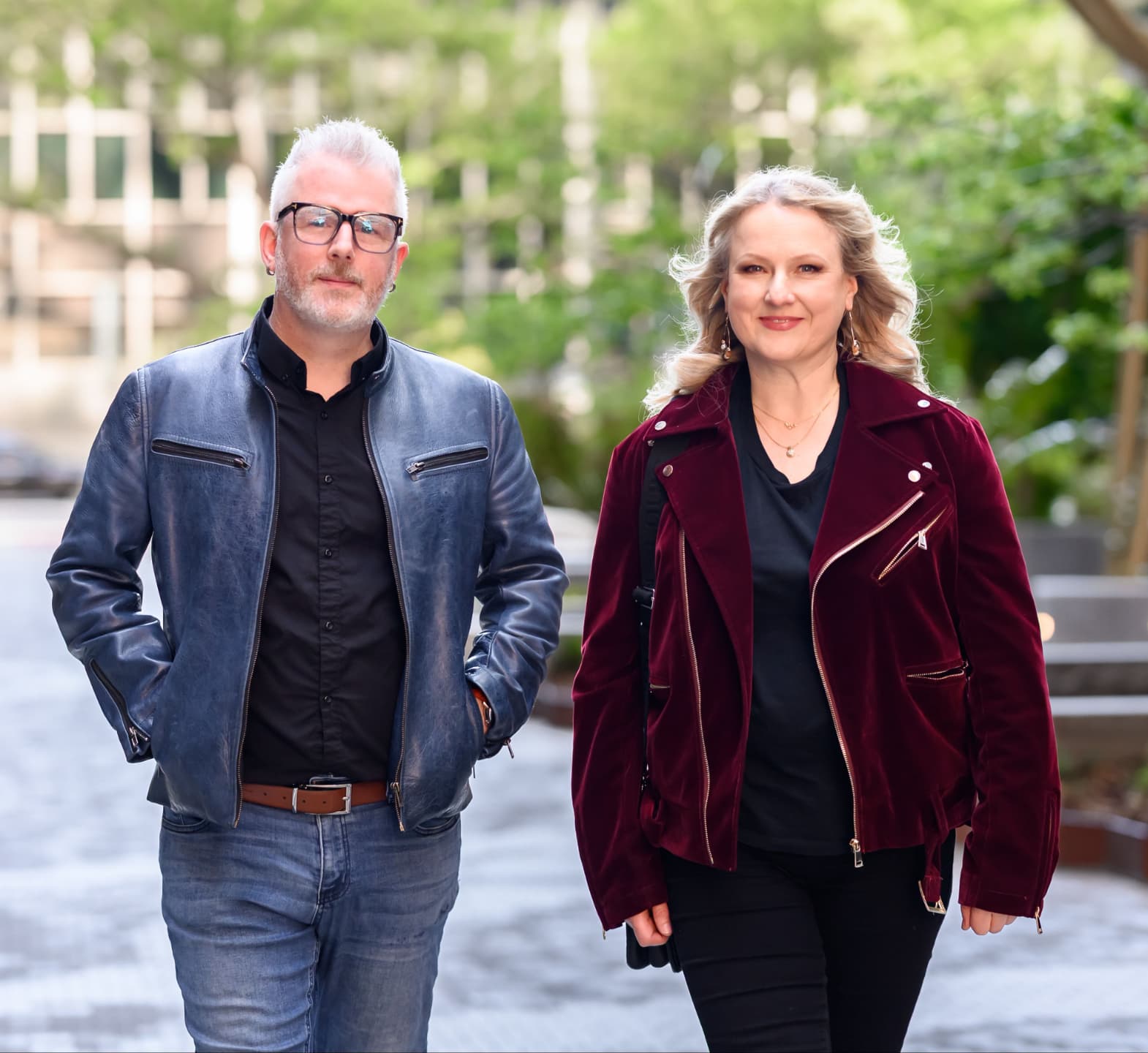 Alex Hagan and Nina Christian walking side by side outdoors