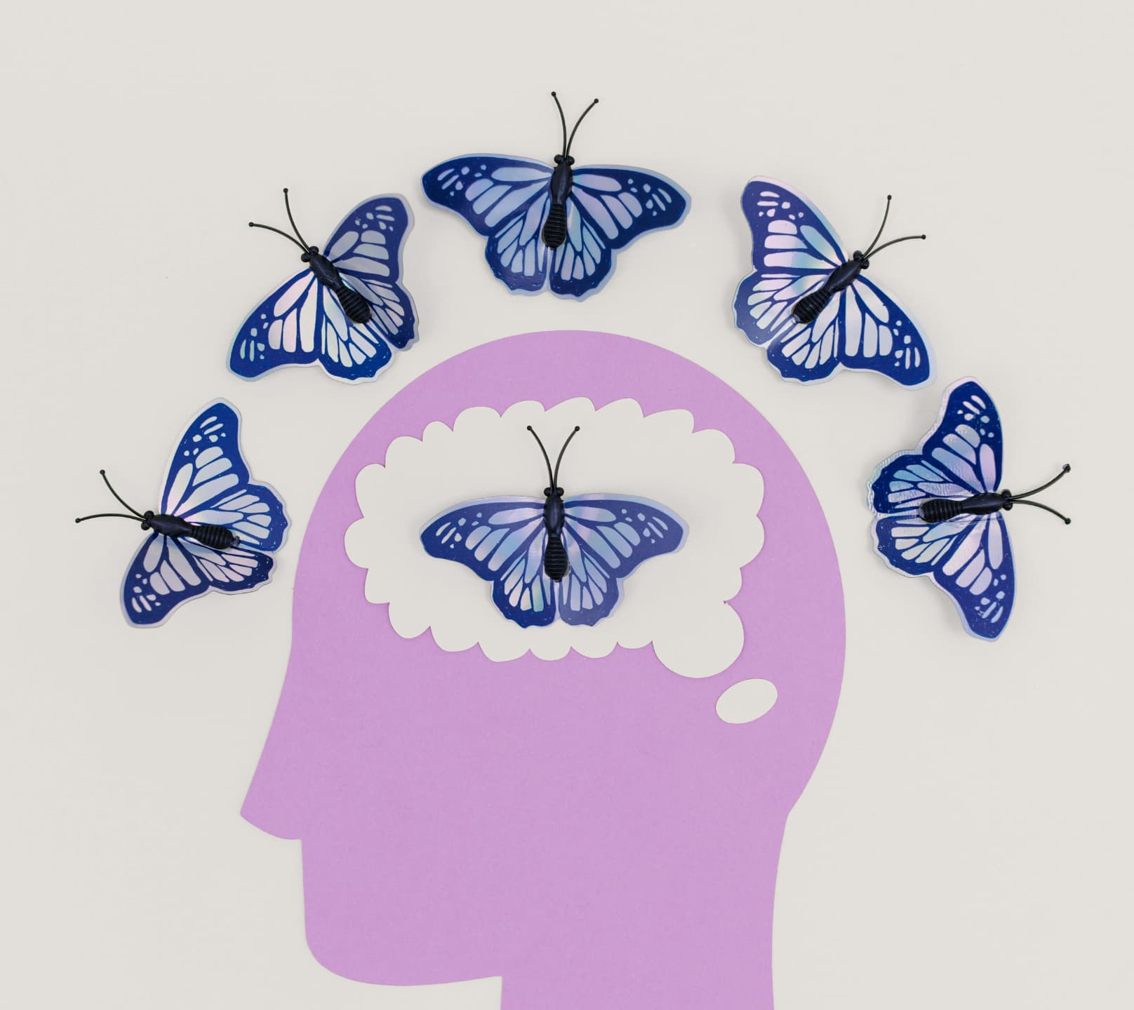 Artwork of a brain with butterflies emerging from it